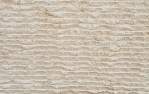 Broached (combed) finish in golden Minya limestone