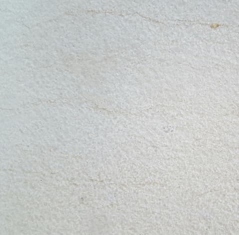 Bush-hammered limestone finish, close-up