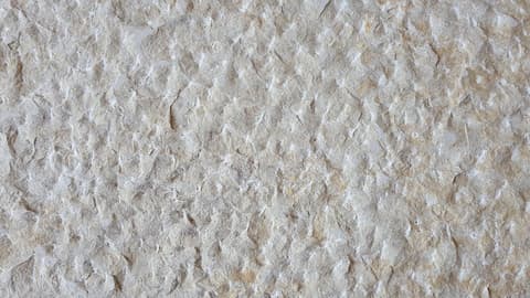 Rock-face chiseled limestone texture