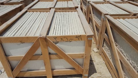 Wooden export crate packed with limestone strips