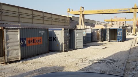 Raya Stone factory yard with gantry cranes and containers