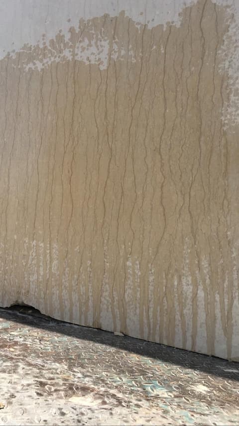 Cut face of a Minya marble block showing straight vertical veining