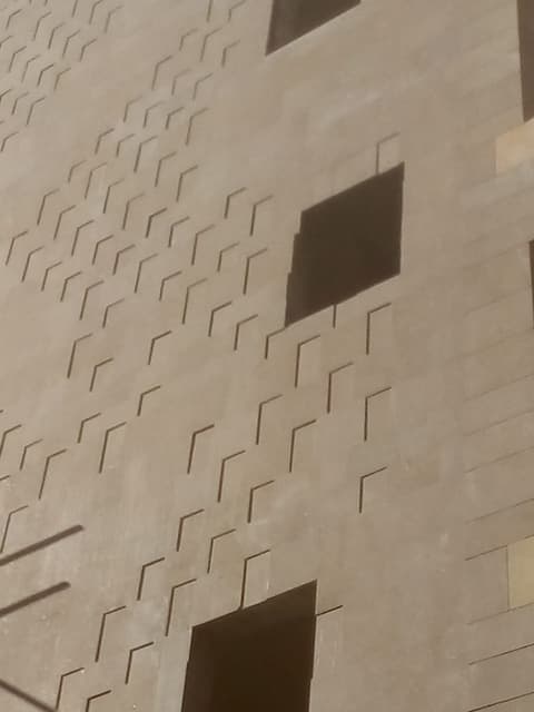 Detail of patterned limestone facade cladding