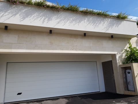 Villa garage facade clad in Sunny Minya limestone