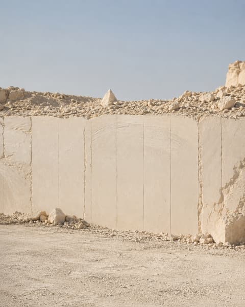 Sawn working face at the Minya quarry, showing vertical cuts in cream marble
